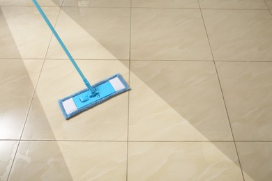 Image of Washing of floor with mop. Difference before and after cleaning