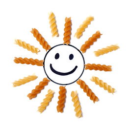 Photo of Sun made with fusilli pasta on white background, top view