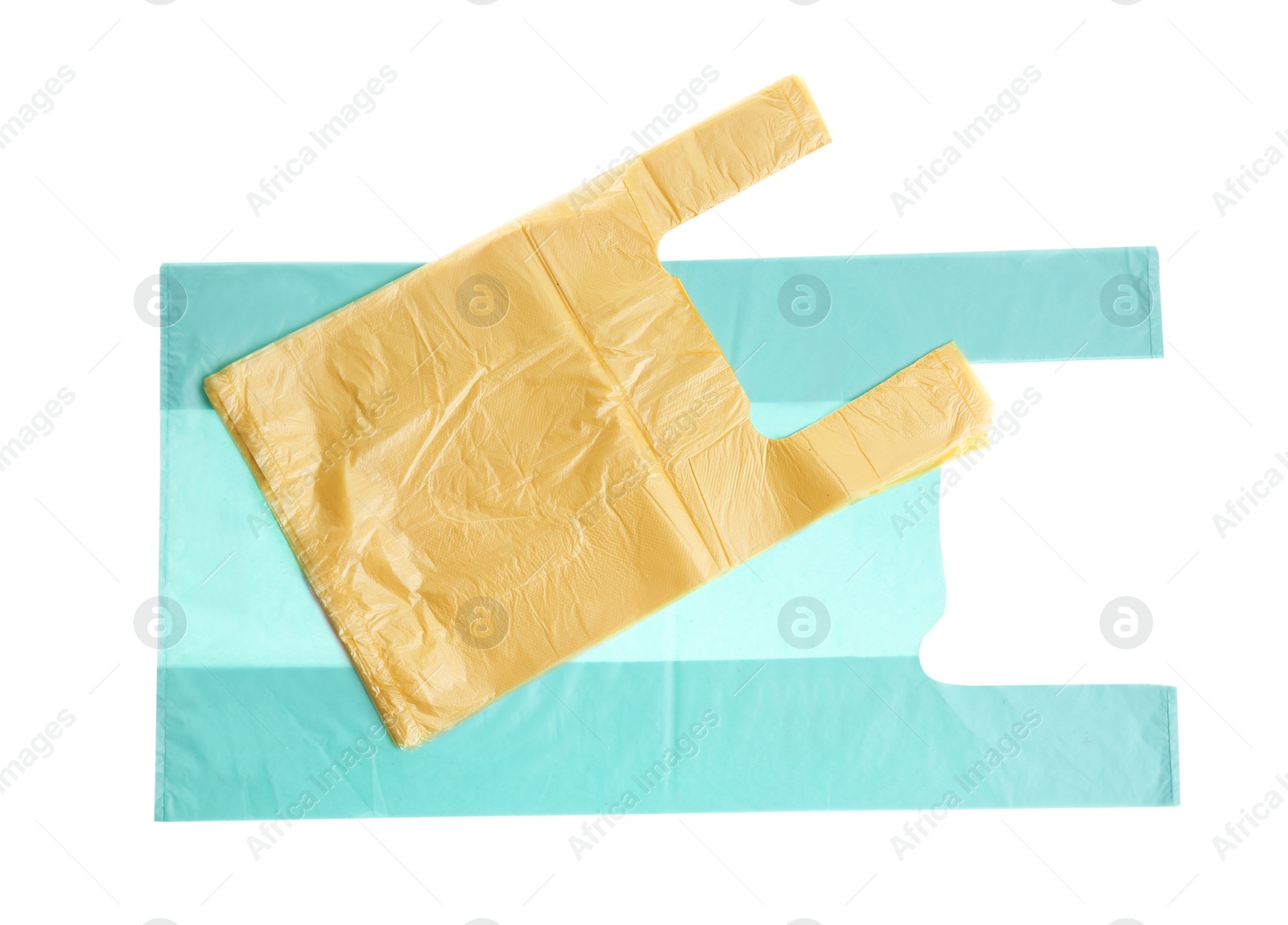 Photo of Stack of plastic bags isolated on white, top view