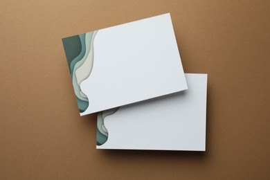 Photo of Blank invitation cards on beige background, flat lay. Space for text