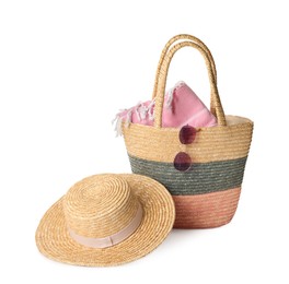 Stylish straw hat, beach bag and sunglasses on white background