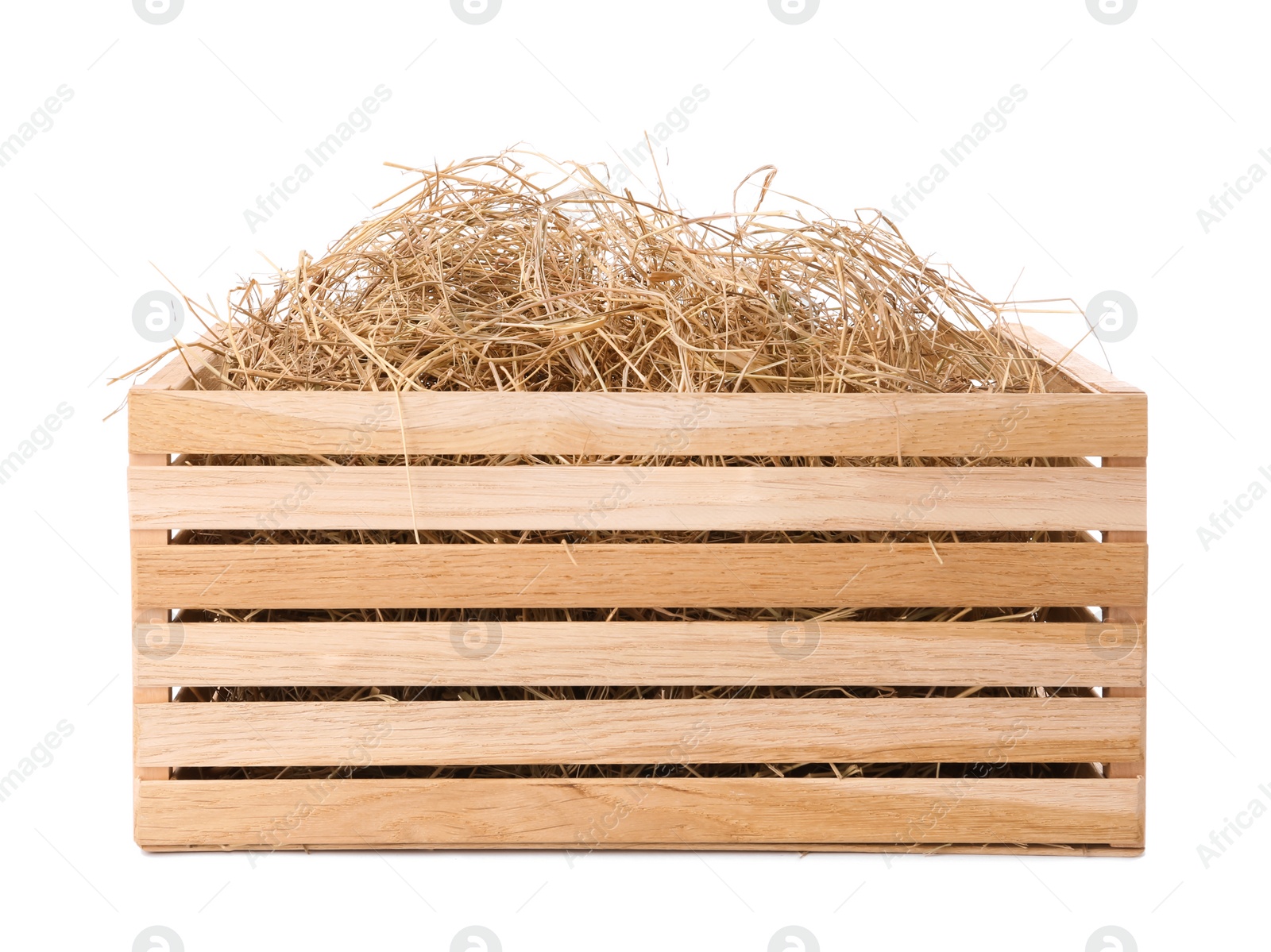 Photo of Dried hay in wooden crate on white background