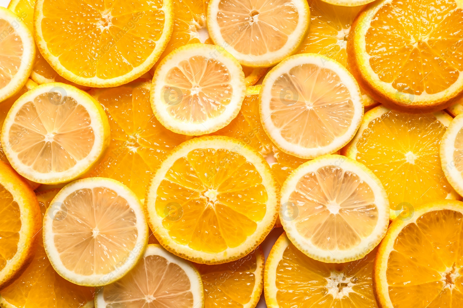 Photo of Slices of citrus fruits as background, top view