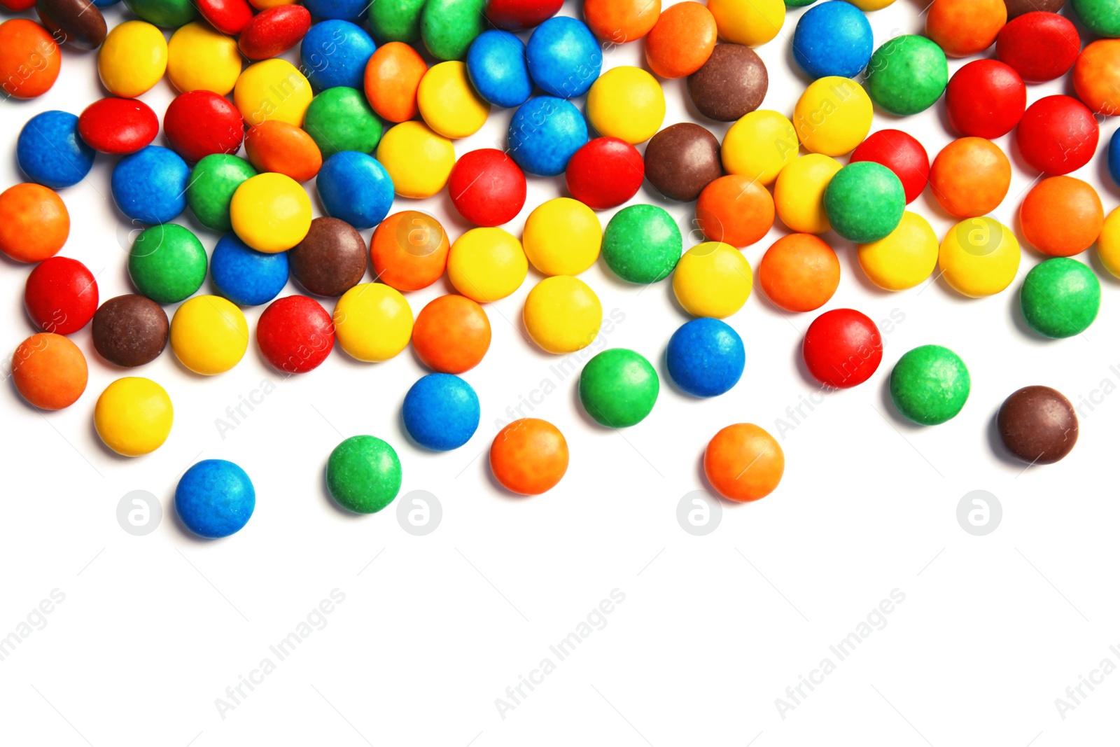 Photo of Tasty colorful candies on white background, top view