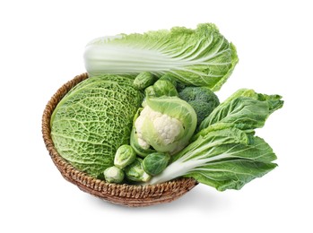 Photo of Wicker bowl with different types of fresh cabbage on white background