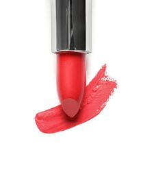 Photo of Tube of lipstick and smear isolated on white, top view