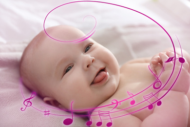 Image of Flying music notes and cute little baby lying on bed, closeup. Lullaby songs 