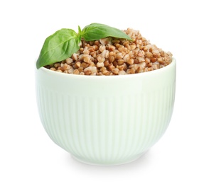 Photo of Bowl of buckwheat porridge with basil isolated on white