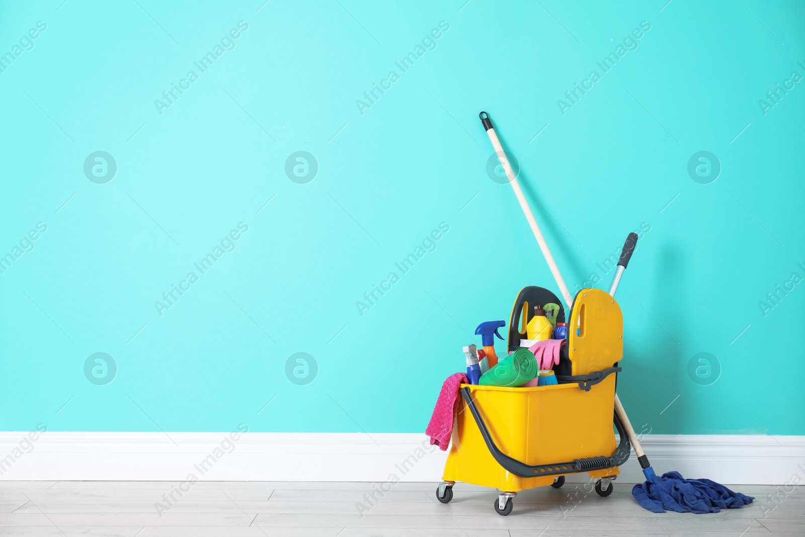 Photo of Set of cleaning supplies on floor indoors