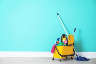 Set of cleaning supplies on floor indoors