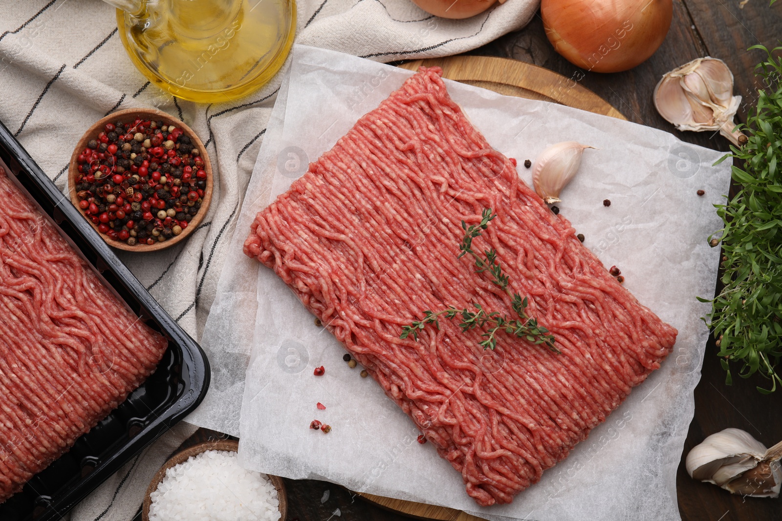 Photo of Flat lay composition with fresh raw ground meat on wooden table