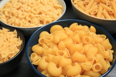 Photo of Different types of pasta on table, closeup