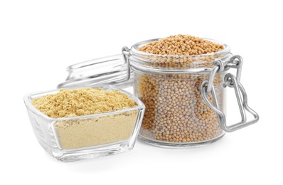 Photo of Aromatic mustard powder in bowl and glass jar with seeds on white background