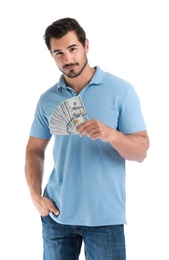 Handsome young man with dollars on white background