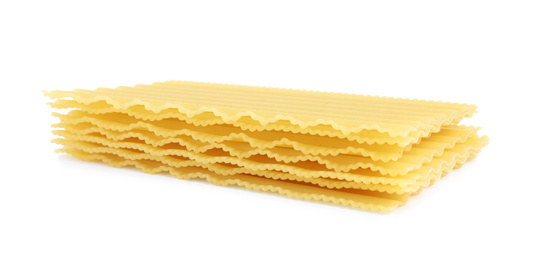 Photo of Stack of uncooked lasagna sheets isolated on white