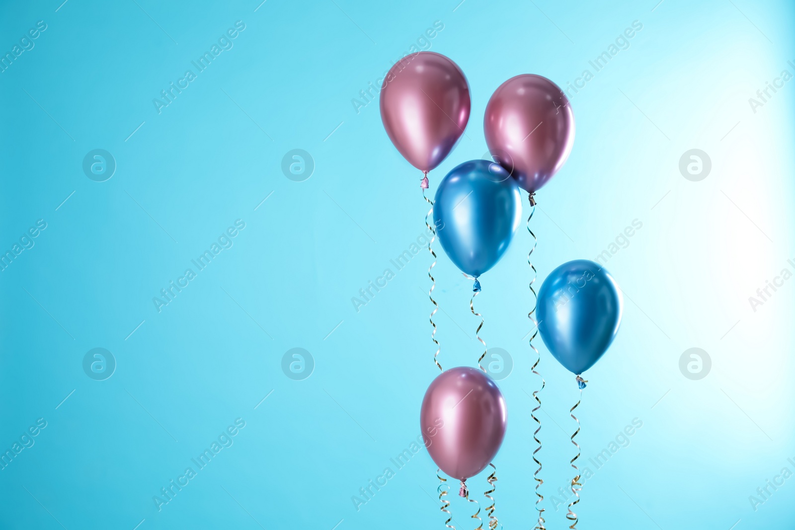 Photo of Bright balloons on color background. Space for text