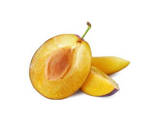 Photo of Pieces of fresh ripe plum on white background
