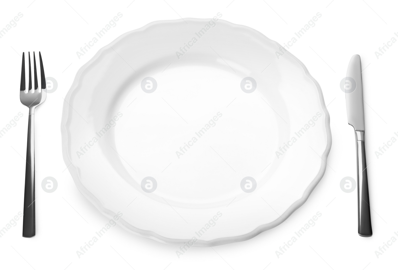 Photo of Empty plate and cutlery on white background. Table setting