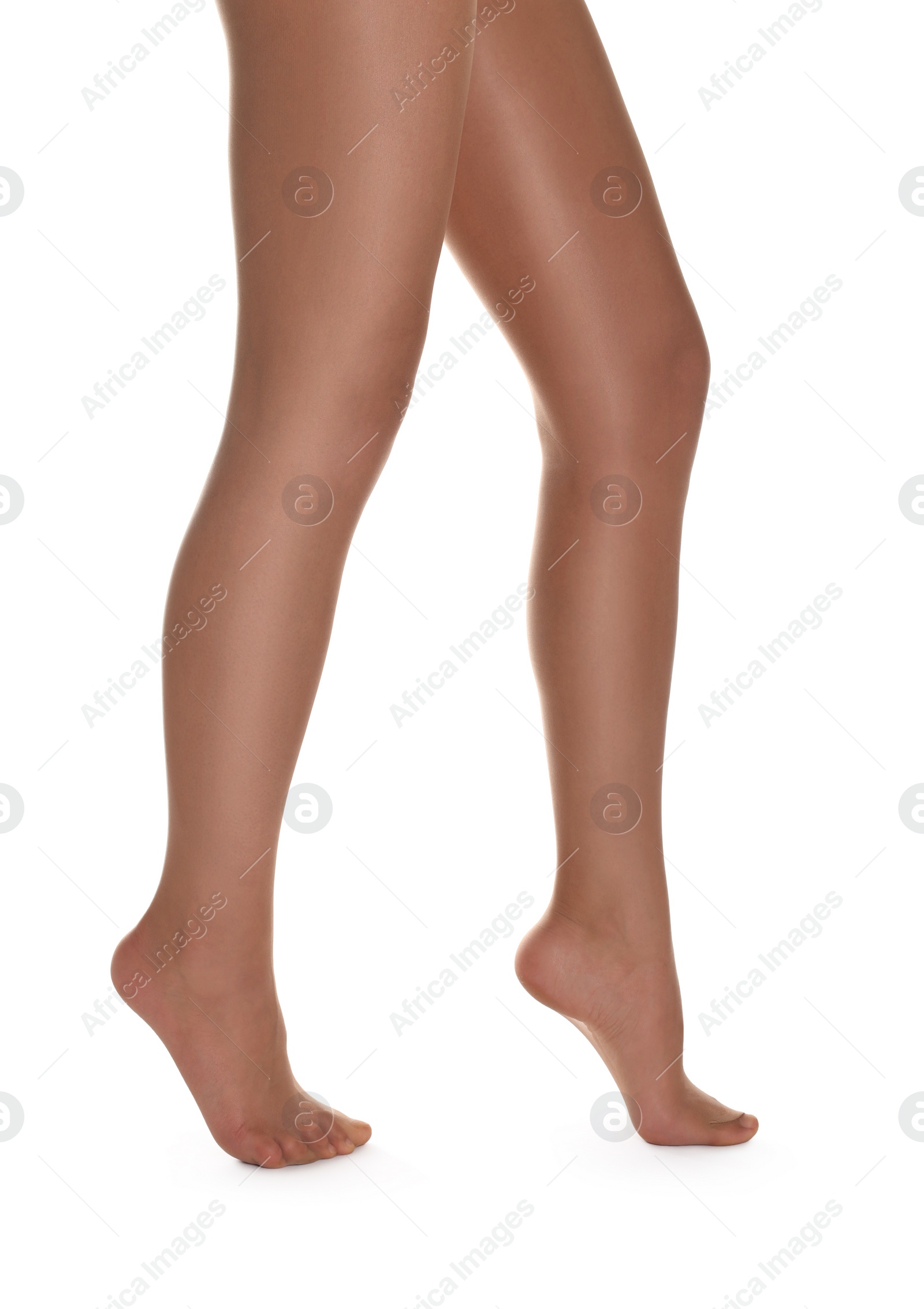 Photo of Woman with beautiful long legs wearing tights on white background, closeup