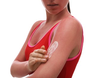 Photo of Woman applying cream on sunburn against white background, closeup