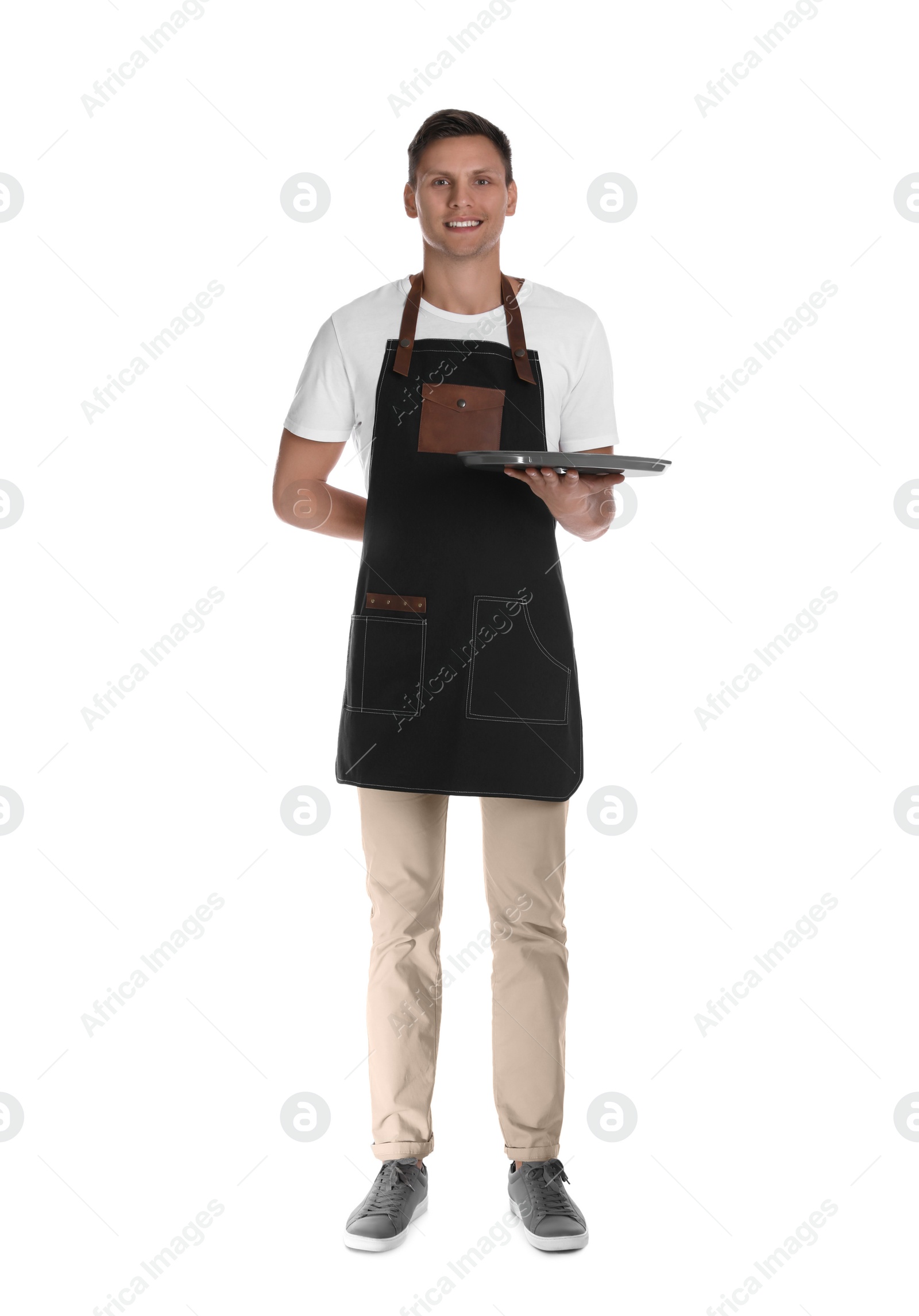 Photo of Full length portrait of happy young waiter with tray on white background