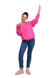 Photo of Happy young woman dancing on white background