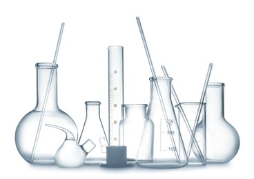 Empty clean laboratory glassware on white background