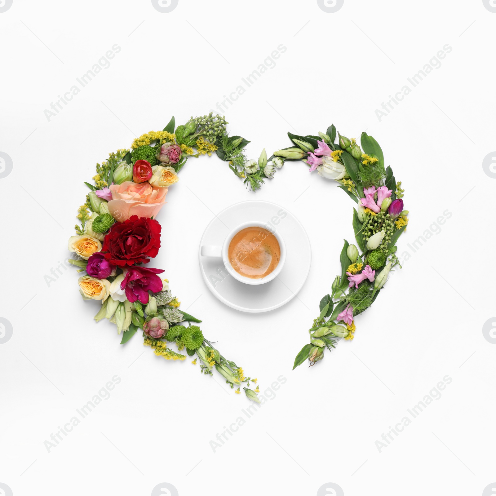 Photo of Beautiful heart shaped floral composition with cup of coffee on light background, flat lay