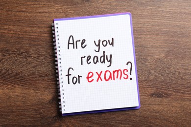 Photo of Notebook with question Are You Ready For Exams on wooden table, top view