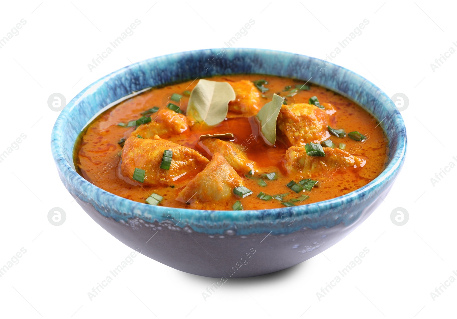 Photo of Bowl of delicious chicken curry on white background