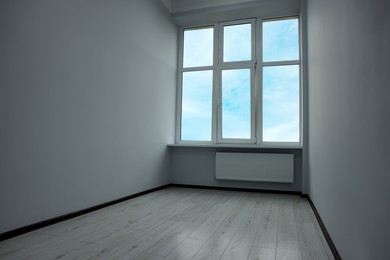 New empty room with clean windows and white walls