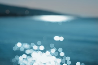 Photo of Blurred view of sea on sunny day, bokeh effect