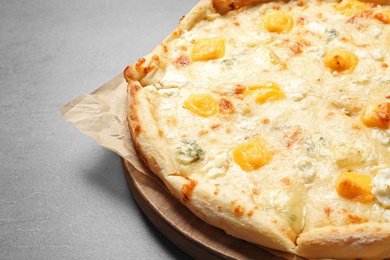Hot cheese pizza Margherita on grey background, closeup. Space for text