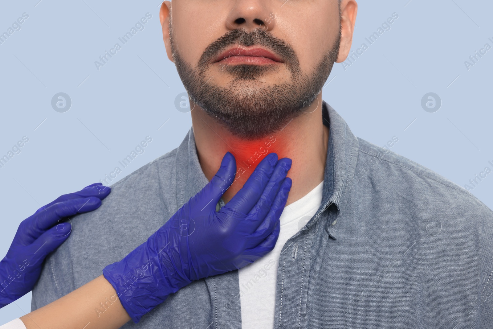 Image of Endocrinologist examining thyroid gland of patient on grey background, closeup