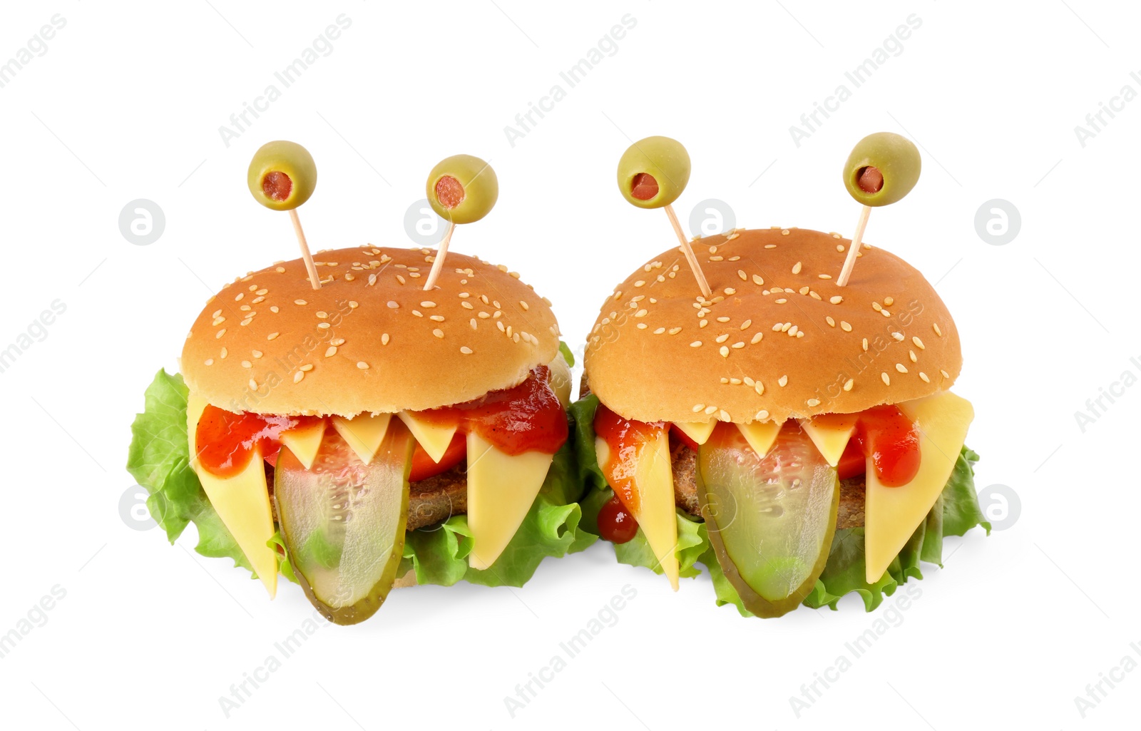 Photo of Cute monster burgers isolated on white. Halloween party food