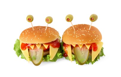 Photo of Cute monster burgers isolated on white. Halloween party food