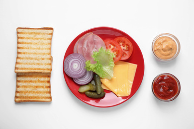 Photo of Fresh ingredients for tasty sandwich on white background, top view