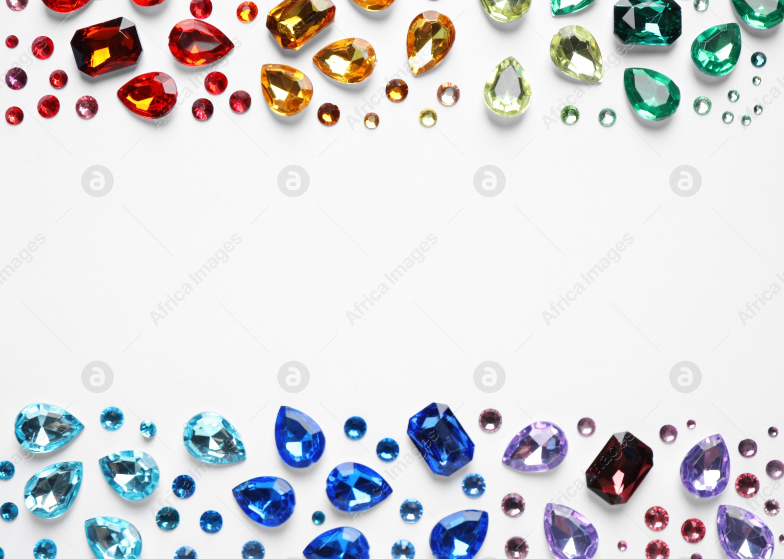 Photo of Frame made of different beautiful gemstones on white background, top view. Space for text