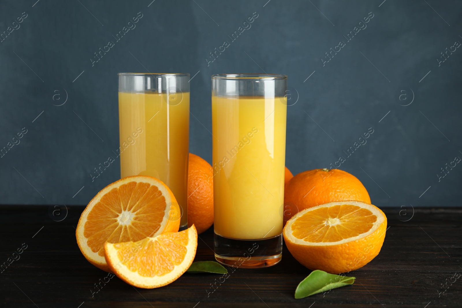 Photo of Composition with orange juice and fresh fruit on table