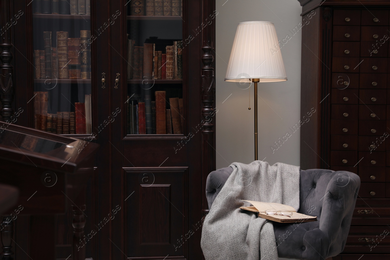 Photo of Library interior with wooden furniture and comfortable place for reading