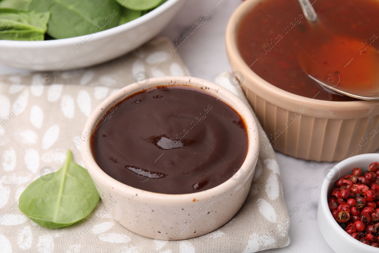 Photo of Fresh homemade marinade in bowl on table, closeup