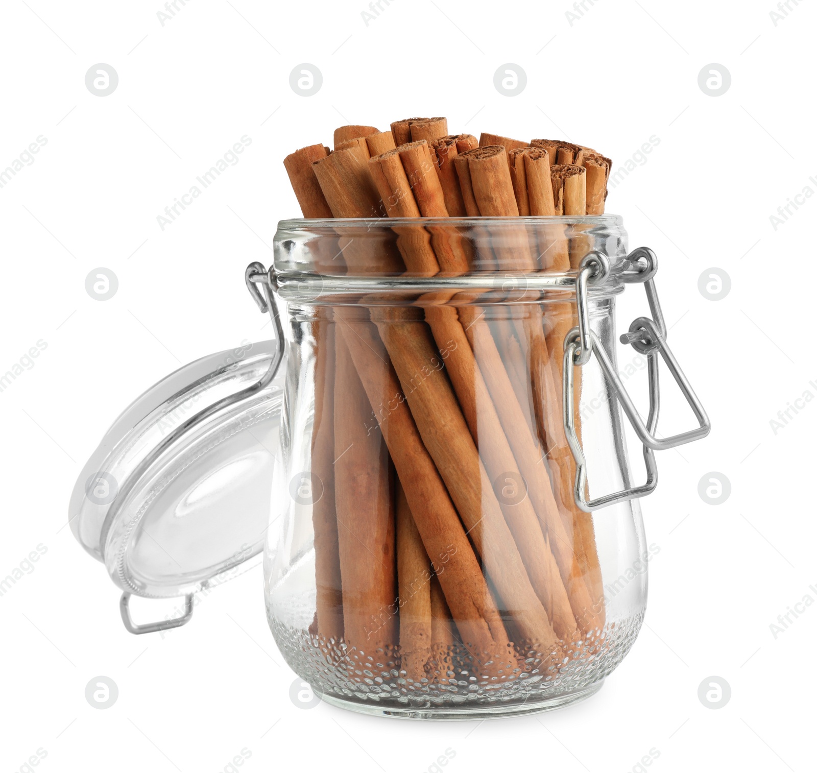 Photo of Aromatic dry cinnamon sticks in glass jar on white background
