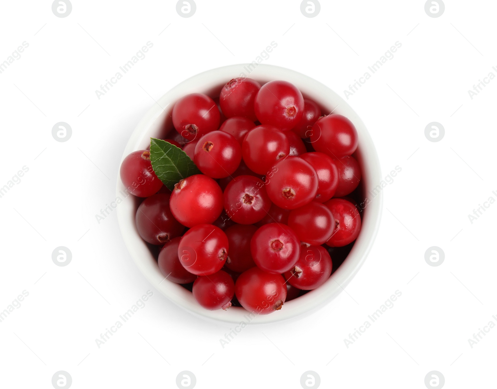 Photo of Fresh ripe cranberries with leaf in bowl on white background, top view