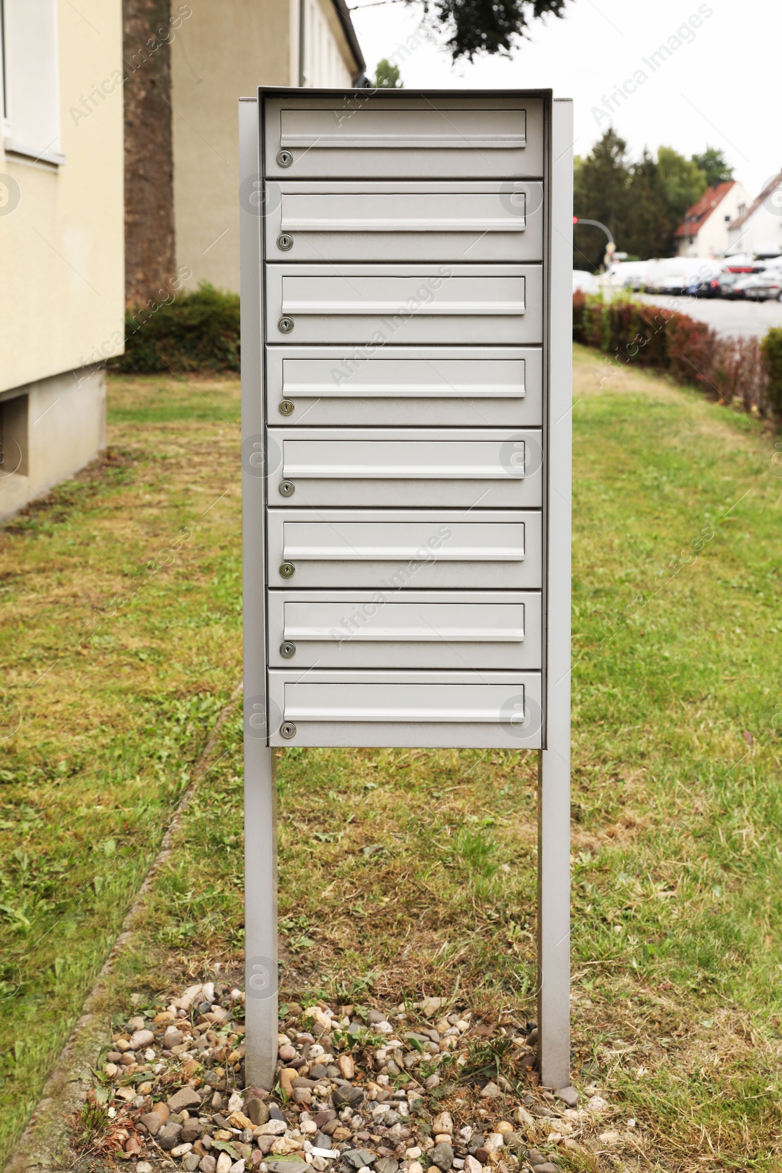 Photo of Metal letter boxes near apartment building outdoors