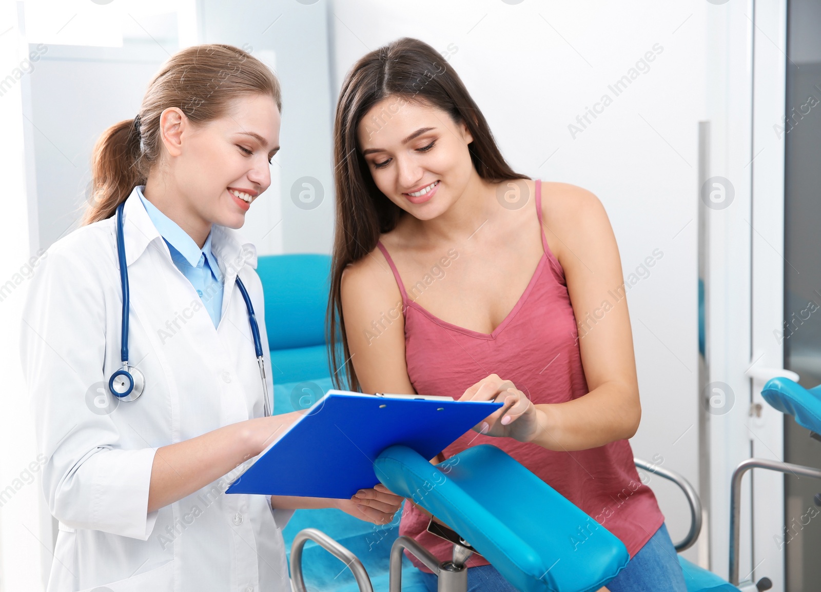 Photo of Young woman having appointment at gynecologist office