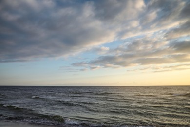 Photo of Picturesque view of beautiful sky with clouds over sea at sunset