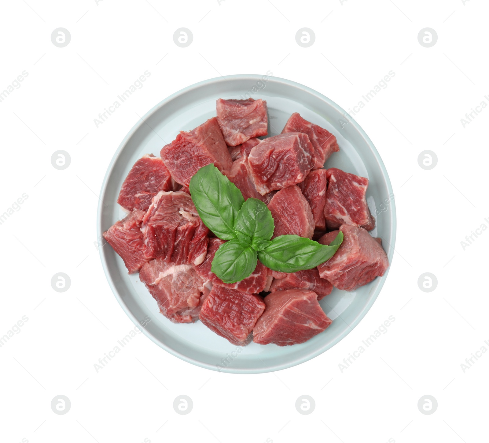 Photo of Fresh raw cut beef with basil leaves isolated on white, top view