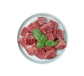 Photo of Fresh raw cut beef with basil leaves isolated on white, top view
