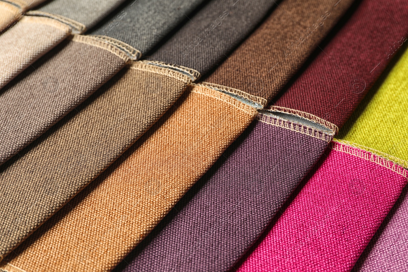 Photo of Fabric samples of different colors for interior design as background