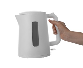 Woman holding modern electric kettle on white background, closeup